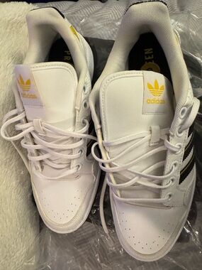 adidas White Sneakers with Black Stripes and Yellow Logo